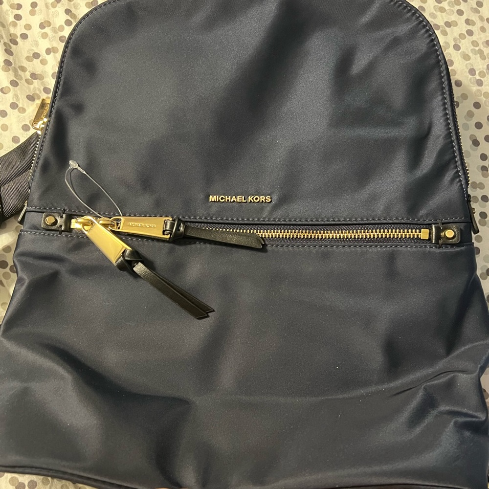 Navy blue Michael kors backpack.